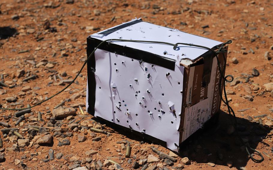 A bullet-ridden box used as a target during a Smart Shooter sighting device familiarization range exercise near al-Tanf garrison, Syria, May 30, 2020.