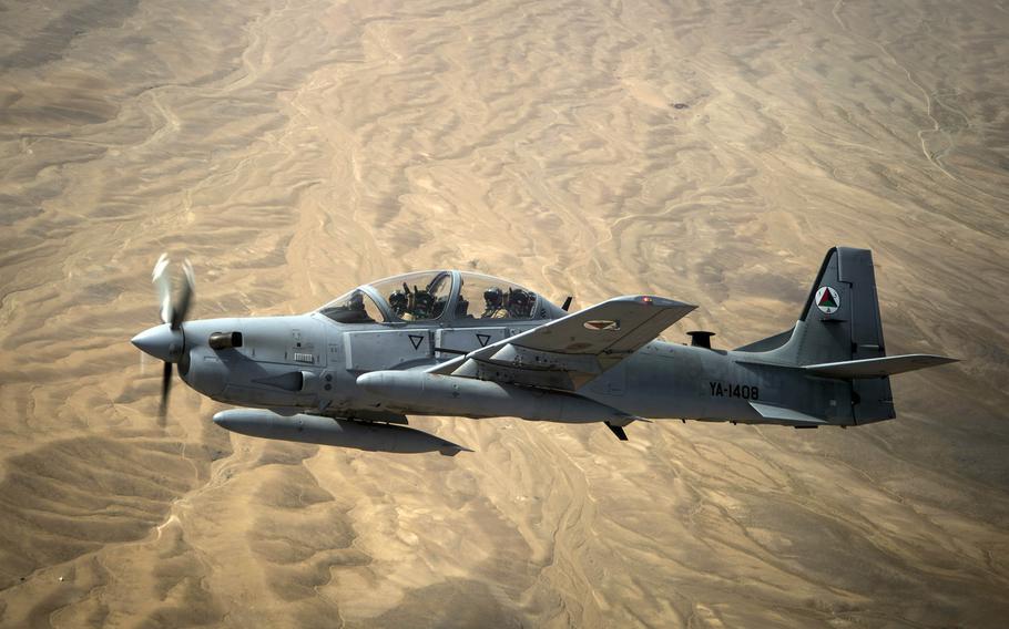 An Afghan air force A-29 Super Tucano flies over Afghanistan in 2015. An American pilot was able to eject when the A-29 plane he was flying crashed in Baghlan province on Thursday, July 9, 2020.