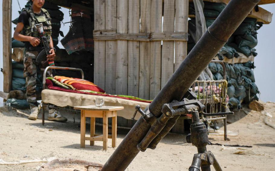 Afghan militia members stand guard at an outpost in Achin district in Nangarhar province in eastern Afghanistan. Since the U.S. withdrew from two bases in the province in May and July 2020, the Taliban have stepped up attacks, local officials say.