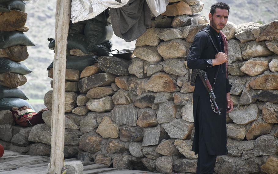 An Afghan militia fighter mans a small outpost in Achin district, Nangarhar province, in eastern Afghanistan, on July 26, 2020. Since the U.S. withdrew from two bases in the province in May and July 2020, the Taliban have stepped up attacks, local officials say.