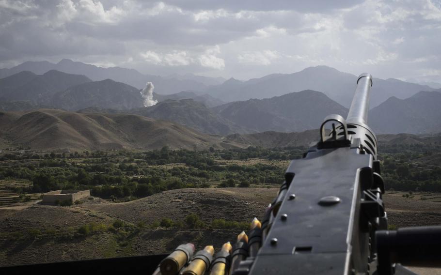 A machine gunner's view of the aftermath of a bombing run by a U.S. F-16 jet against positions held by Islamic State militants in Deh Bala district in Nangarhar province, July 7, 2018. 