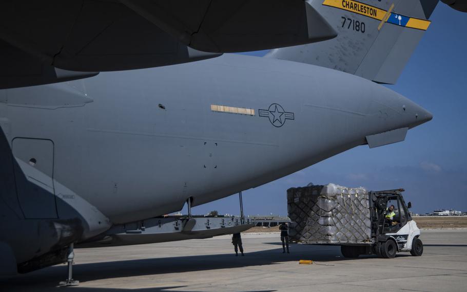 An aerial porter offloads pallets of food and water from a C-17 Globemaster III that flew into Beirut, Lebanon, from Ali Al Salem Air Base, Kuwait, in support of U.S. relief efforts Aug. 7, 2020.