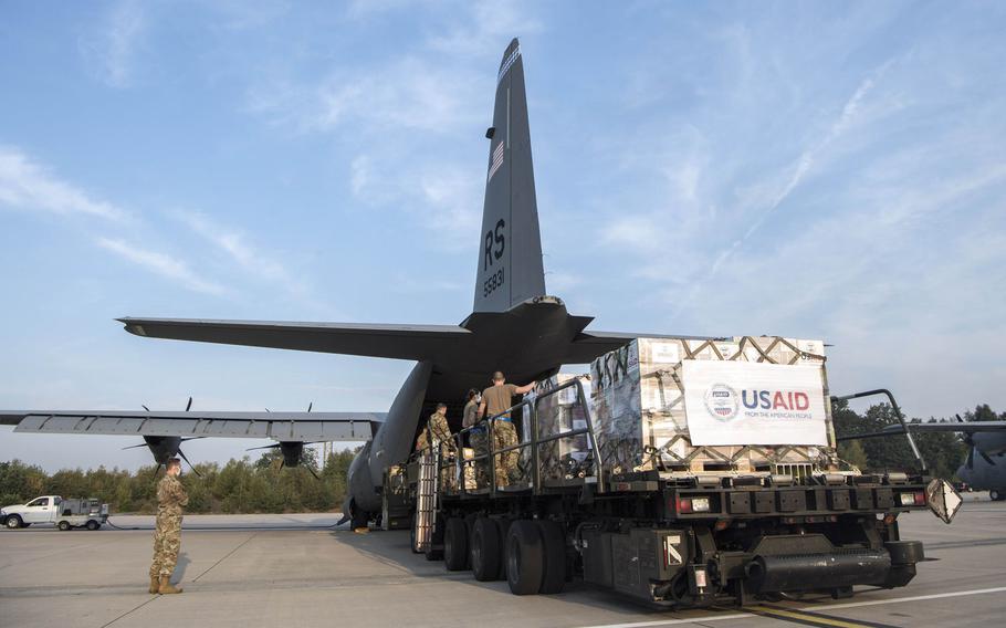 Members of the 721st Aerial Port Squadron load a C-130J Super Hercules at Ramstein Air Base, Germany, Aug. 11, 2020, with relief supplies for Lebanon.