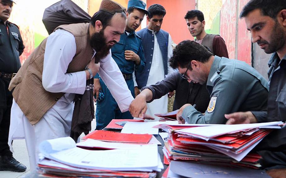 A Taliban prisoner has his biometric data recorded before being freed from a government jail in Afghanistan on Thursday, August 13, 2020.