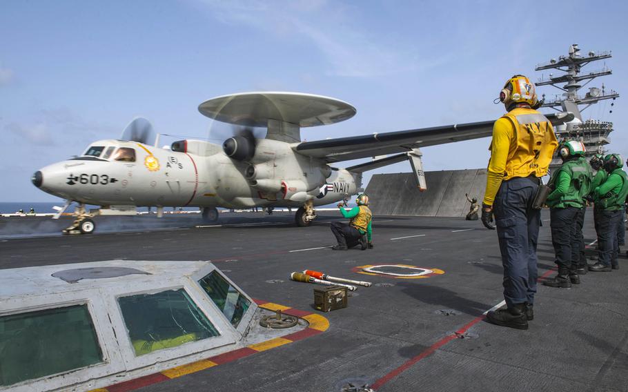 An E-2C Hawkeye launches off the flight deck of the aircraft carrier USS Nimitz in the Arabian Sea, Sept. 3, 2020. The Nimitz and U.S. navy ships were joined by Air Force aircraft in searching for a U.S. sailor missing in the North Arabian Sea since Sept. 6, 2020.