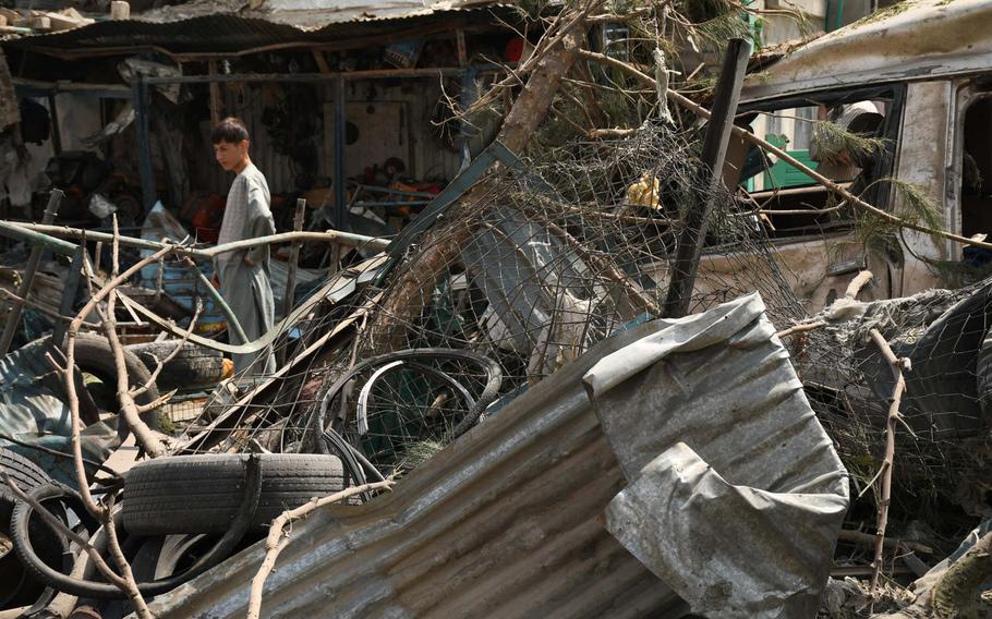 An Afghan boy stands among the rubble of a bomb blast in Kabul on Wednesday, Sept. 9, 2020. At least 10 civilians were killed in the powerful blast, which the Interior Ministry says was an attempt to assassinate First Vice President Amrullah Saleh.