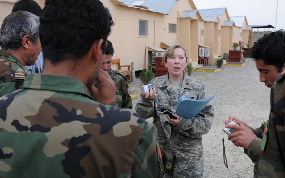 Maj. Christy Barry speaks Dari with Afghan national army officers at the Counter Insurgency Training Academy on Camp Julien, Afghanistan, April 2010. The Afghanistan-Pakistan Hands program, which trained service members to be cultural experts versed in Central Asian languages, ended  Sept. 30, 2020.