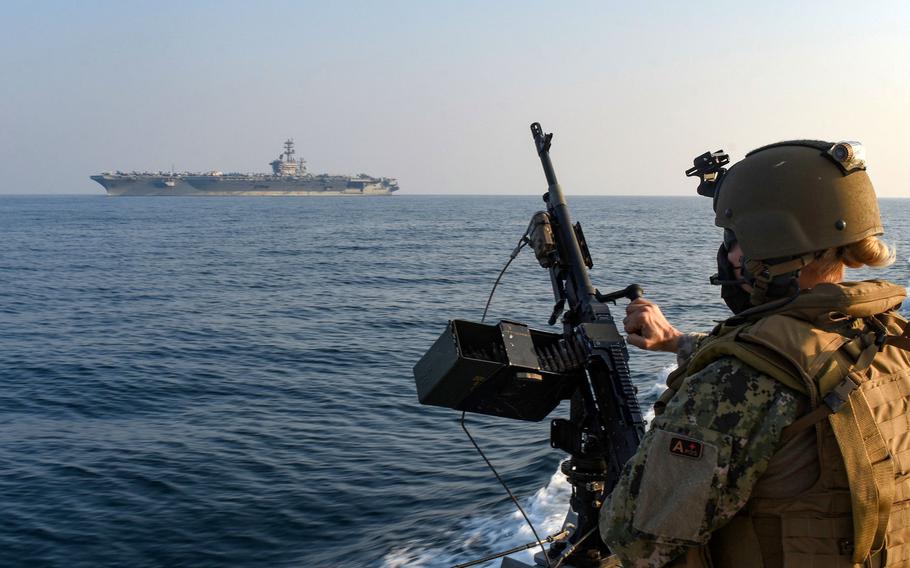 Chief Petty Officer Jennifer Kwiatkowski stands security watch aboard a Mark VI patrol boat during an escort of the aircraft carrier USS Nimitz through the Gulf of Bahrain, inbound to a maintenance and logistics visit in Bahrain, Oct. 7, 2020.