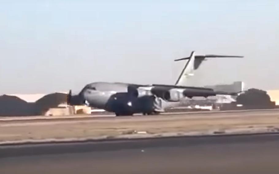 In this YouTube screenshot, a U.S. Air Force C-17 Globemaster III makes an emergency landing at Ahmad Shah Baba International Airport in Kandahar, Afghanistan, Oct. 18, 2020, with the nose landing gear still up.
