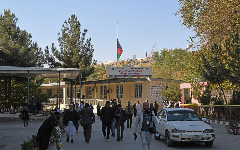 An Afghan flag flies at half-staff over Kabul on Tuesday, Nov. 3, 2020, as the country mourned 22 people, most of them students, who were killed when Islamic State gunmen stormed Kabul University a day earlier.