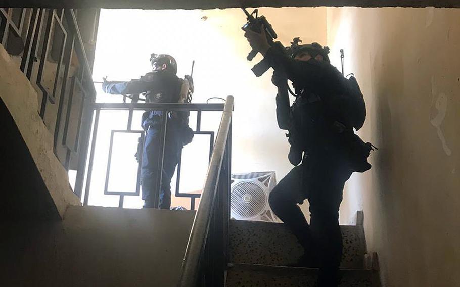 Iraqi counterterrorism troops raid a compound in Fallujah during the last week of October. They captured a suspected member of an Islamic State group child recruitment ring, U.S. and Iraqi officials said.