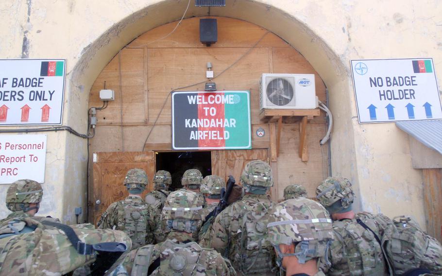 Soldiers from 3-2 Stryker Brigade Combat Team arrive at Kandahar Airfield, Afghanistan, Dec. 15, 2011. Control of the airpost, Afghanistan's second largest, is supposed to pass to locals when the U.S. and NATO leave the country but officials say Afghans don't have the training or knowledge to run the facility.
