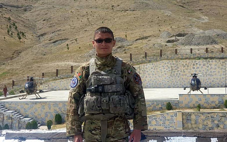 Afghan pilot Maj. Mohammad Naiem Asadi poses for a photo taken in October 2020. Asadi and his family had been approved to come to the U.S. for their protection until the Pentagon reversed its endorsement of their exit.