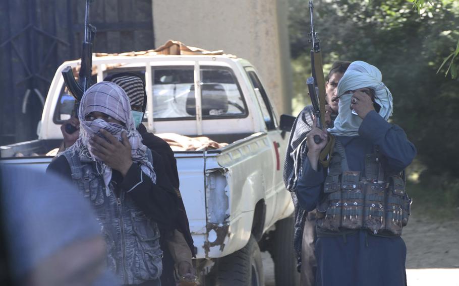 Armed alleged Taliban shoot photos of an Army National Army convoy in Logar province during unprecedented mutual cease-fires between the Taliban and the Afghan government over the weekend.
