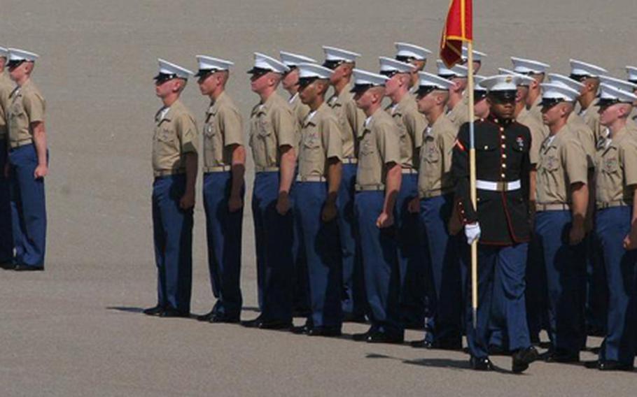 Marines stand in formation awaiting the arrival of Defense Secretary Robert Gates on Aug. 13, 2010, at Marine Corps Recruit Depot San Diego. Gates presided over the graduation of 196 recruits in six platoons.