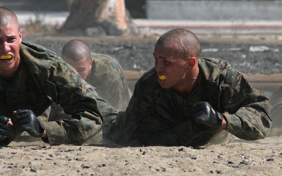 Marine recruits crawl through dust 