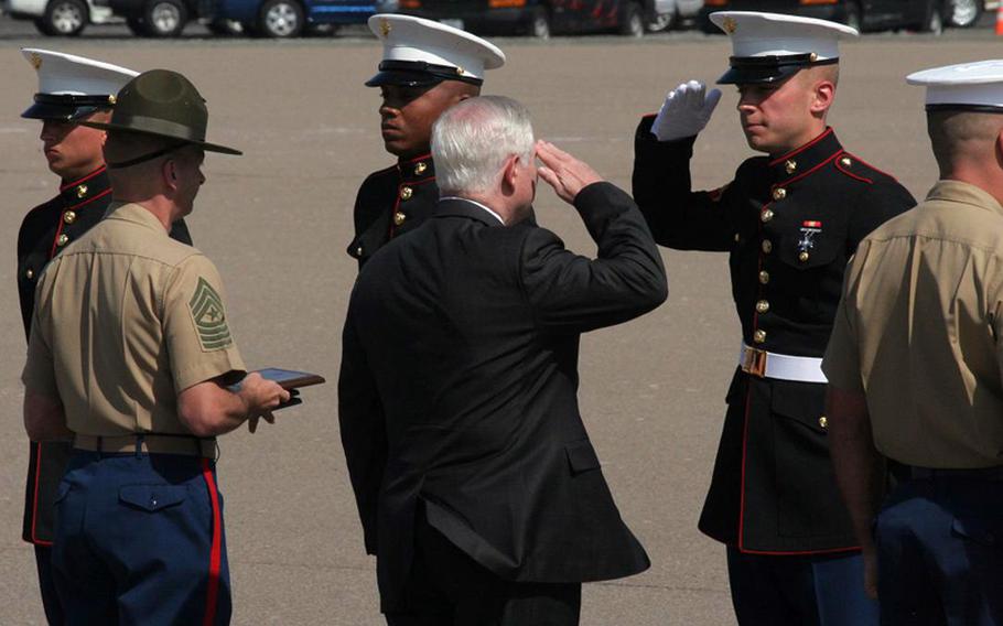 Defense Secretary Robert Gates, center, salutes Marines in formation during a visit Aug. 13, 2010,  to Marine Corps Recruit Depot San Diego. Gates presided over the graduation of 196 recruits in six platoons.