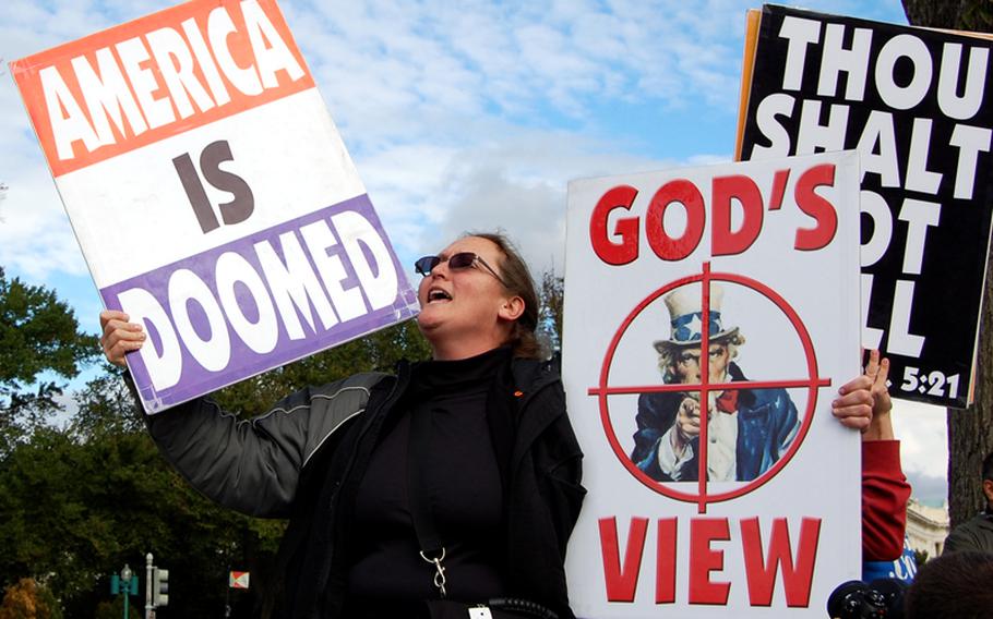 Abigail Phelps, a member of the Westboro Baptist Church, protests outside the U.S. Supreme Court in October.
