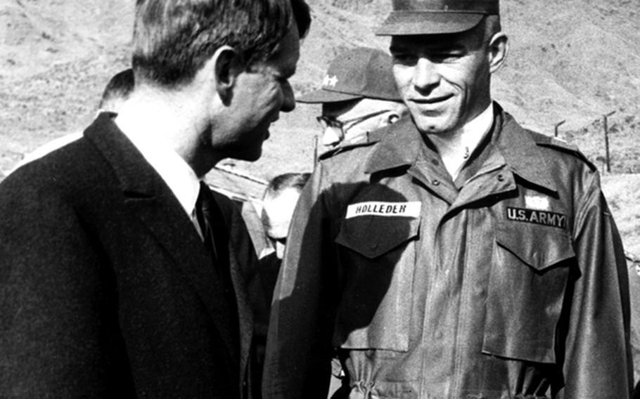 Attorney General Robert F. Kennedy talks with Capt. Don Holleder, a former West Point football star, during a visit to South Korea in January, 1964. Holleder was killed by a sniper in 1967. On Friday, he was posthumously awarded the Distinguished Service Cross, the second-highest combat award.