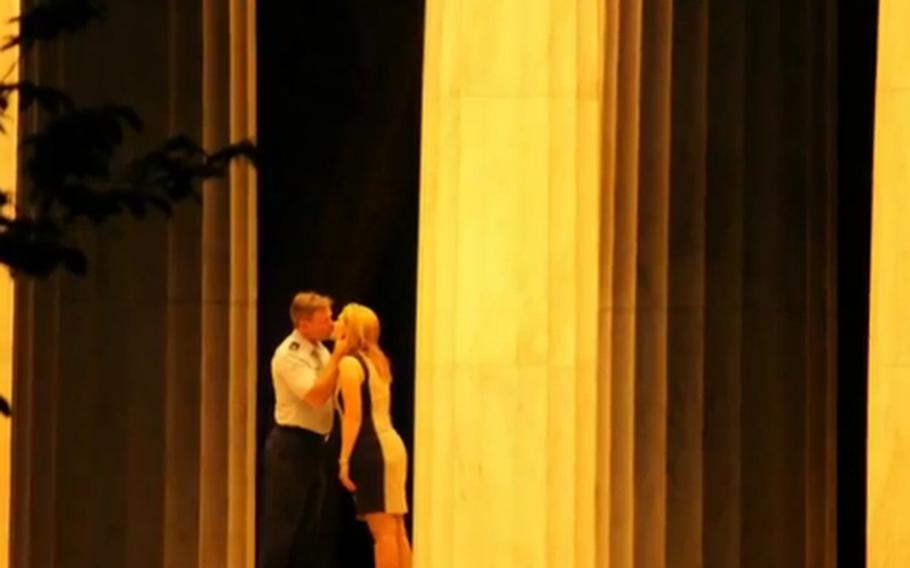 The photographer who captured these intimate photos at a D.C. war memorial on July 2, 2012, is trying to contact the couple involved.