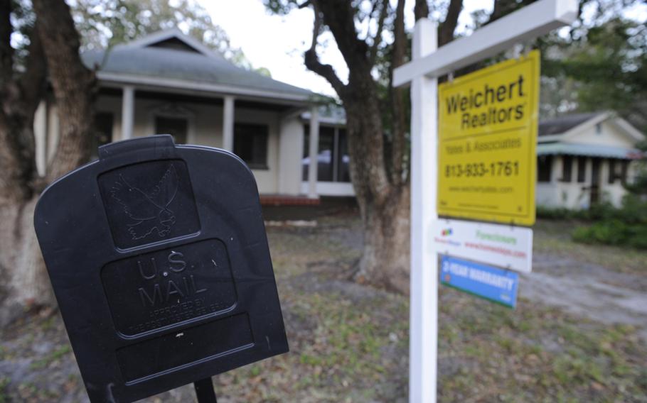 
A foreclosure sign is posted outside a house in Tampa, Fla., January 16, 2012.

