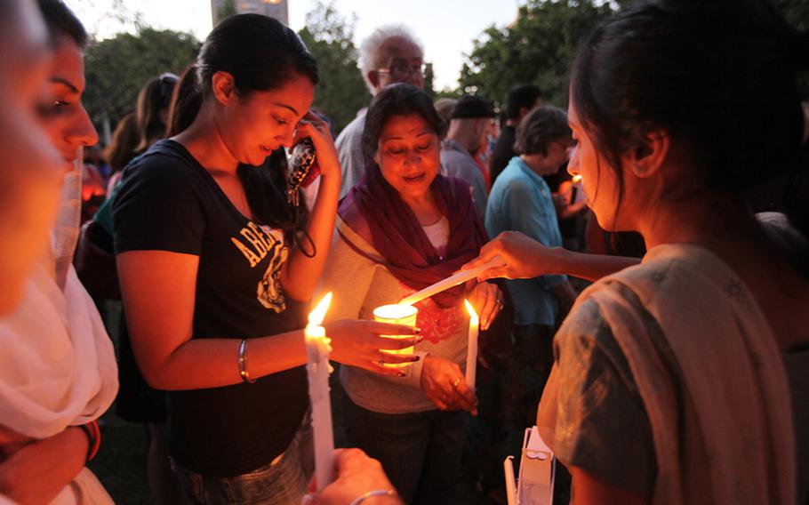 Members of the Oak Creek Sikh temple reflect about family friends who were victims of the shooting at the Sikh Temple in Oak Creek, Wisconsin on Aug. 5, 2012.

