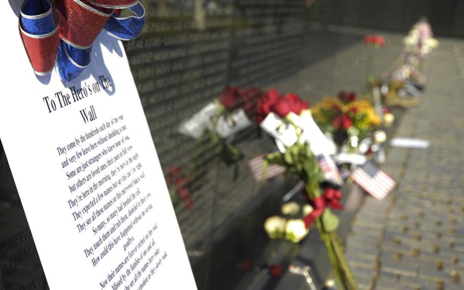 Mementos left at the Vietnam Veterans Memorial on Nov. 11, 2012, pay tribute to those who died in the war.