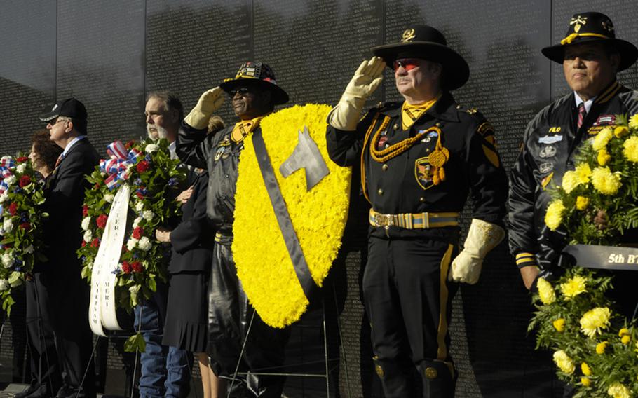 1st Cavalry veterans and other visitors to the Vietnam Veterans Memorial on Nov. 11, 2012 pay tribute to those killed in the war during a wreath-laying ceremony.