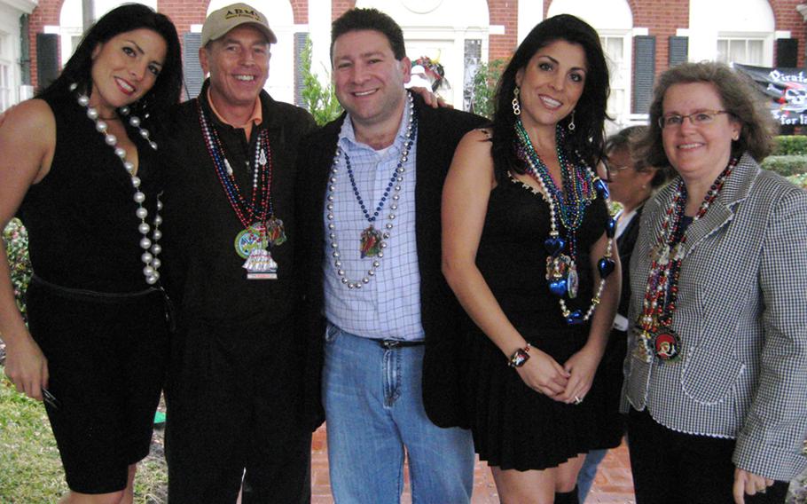 In this file photo dated January 30, 2010, Natalie Khawam, from left; Gen. David Petraeus; Scott and Jill Kelley; and Holly Petraeus watch the Gasparilla parade in Tampa, Florida. 