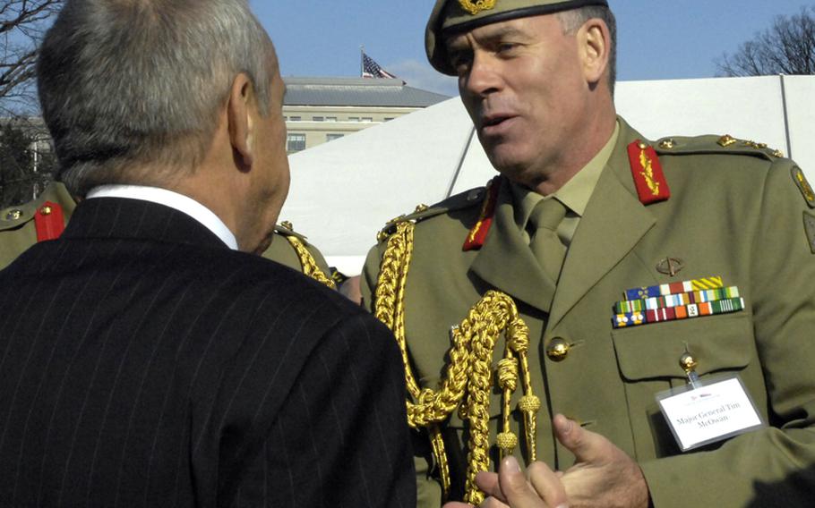 Maj. Gen. Tim McOwan of the Australian Army talks with Vietnam Veterans Education Fund president Jan Scruggs after the groundbreaking ceremony for the Education Center at the Wall in Washington, D.C., on November 28, 2012.