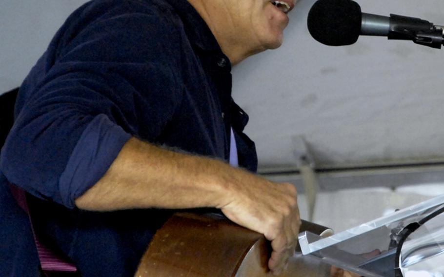 Singer-songwriter Jimmy Buffett performs at the groundbreaking ceremony for the Education Center at the Wall in Washington, D.C., on November 28, 2012. Buffett is a member of the honorary groundbreaking committee.