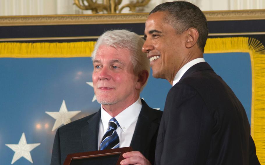 Ray Kapaun poses with President Barack Obama after receiving the Medal of Honor on behalf of his uncle, Father Emil Kapaun.