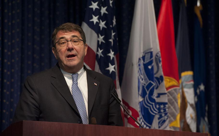 Deputy Secretary of Defense Ashton Carter presents a Joint Meritorious Unit Award to the Defense Threat Reduction Agency, Jan. 25, 2013 at Fort Belvoir, Va.