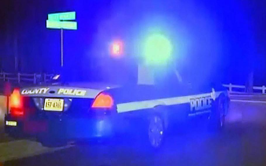 A video screen grab shows a police car at Marine Corps Base Quantico, Va., responding to a shooting incident that left three Marines dead on Thursday, March 21, 2013.