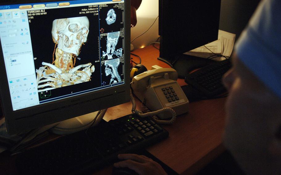 Lt. Col. (Dr.) Wilmer Jones, 332nd Expeditionary Medical Group vascular surgeon, reviews medical images at Joint Base Balad, Iaq on April 13, 2009. 