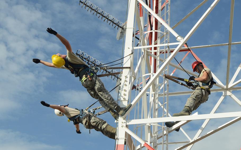 Senior Airmen Skyler Shull and Tony Terry and Airman 1st Class Austin Johnson with the 31st Communications Squadron perform antenna maintenance training June 12, 2013, at Aviano Air Base, Italy. The training included different maintenance techniques, which help them to trust their rappelling equipment. 
