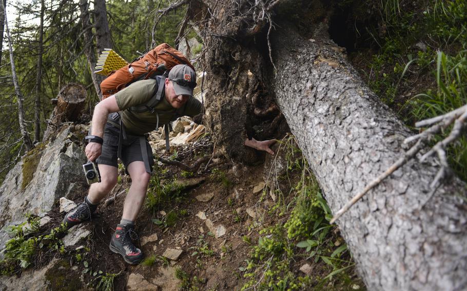 Matt Millham, a Stars and Stripes reporter, navigates a torn out piece of trail during an overnight hiking trip in Chamonix, France.
