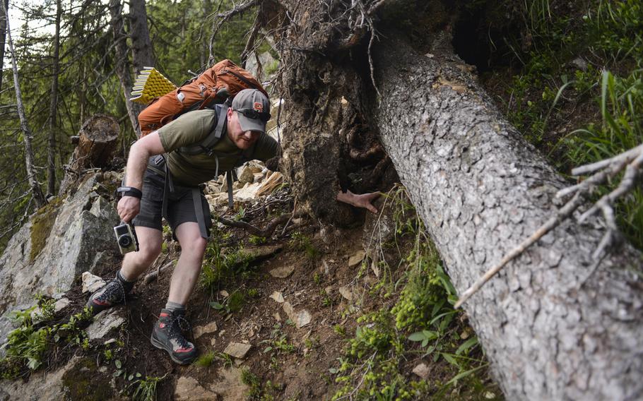 Matt Millham, a Stars and Stripes reporter, navigates a torn out piece of trail during an overnight hiking trip in Chamonix, France.
