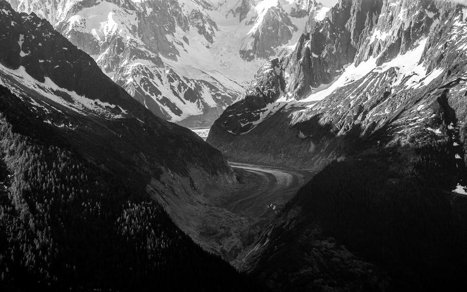 A small piece of the Argentiere glacier near Chamonix, France, is seen through the valley it helped carve.

