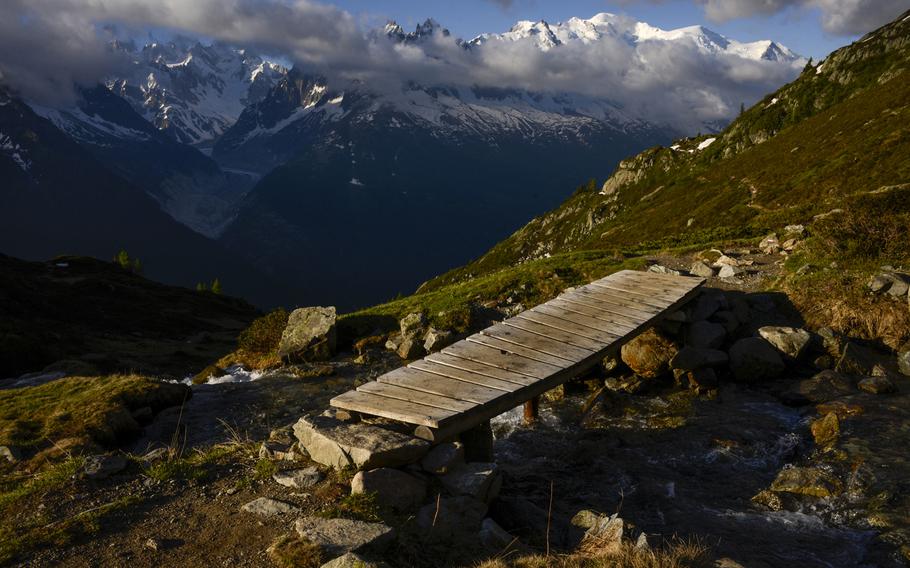 The rounded peak of western Europe's tallest peak, Mont Blanc, is seen from a mountain trail above the Chamonix Valley, France.

