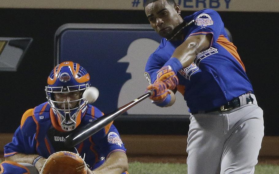 American League's Yoenis Cespedes of the Oakland Athletics hits during the final round of the MLB All-Star baseball Home Run Derby, Monday, July 15, 2013, in New York. (AP Photo/Frank Franklin II)