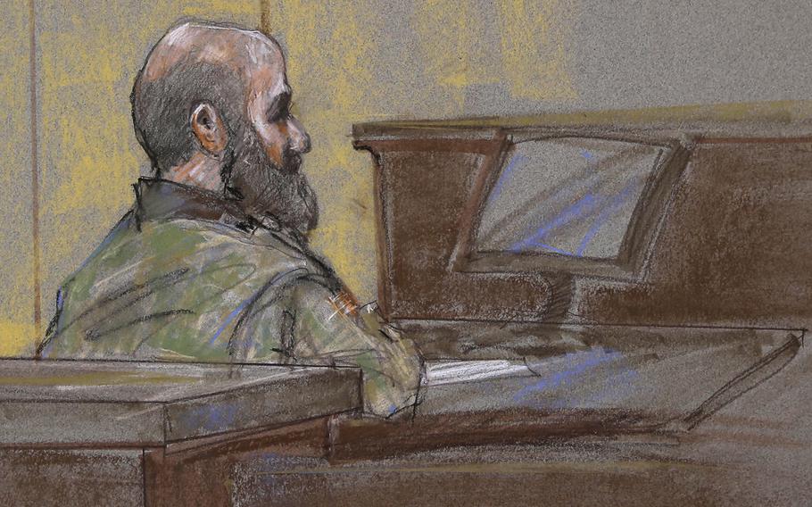 In this courtroom sketch, U.S. Army Maj. Nidal Malik Hasan is shown as the guilty verdict is read at his court martial, on Aug. 23, 2013, in Fort Hood, Texas.  