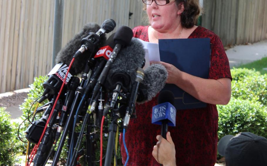 Gale Hunt, mother of Spc. Jason ``J.D.`` Hunt, reads a statement to the media Aug. 28, 2013, at Fort Hood, Texas, after her son's killer, Maj. Nidal Hasan, was sentenced to death.