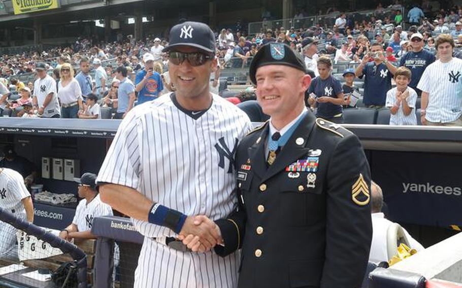 During his tour of New York City and after receiving the Medal of Honor, Army Staff Sgt. Ty Carter visited Yankee Stadium and posed for photos with All-Star Derek Jeter, Aug. 31, 2013.