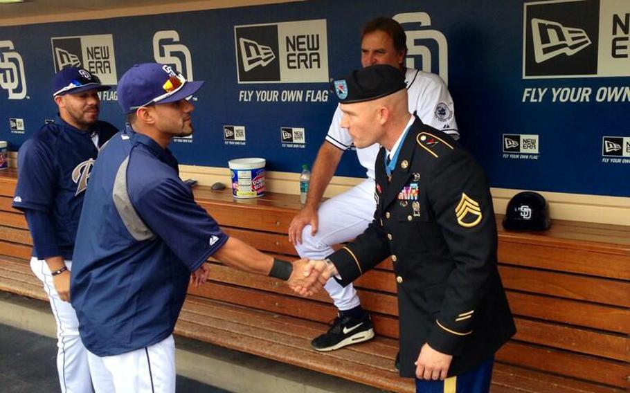 Exactly one week after receiving the Medal of Honor from President Obama, Army Staff Sgt. Ty Carter was shaking hands with San Diego Padres baseball players at Petco Park, where he threw out the ceremonial first pitch on Labor Day, 2013.