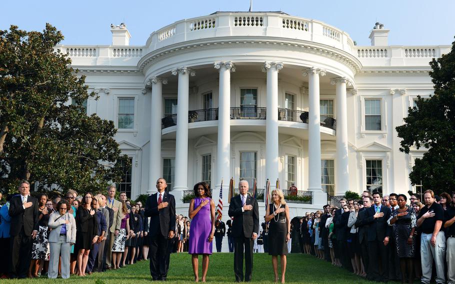 President Barack Obama, first lady Michelle Obama, Vice President Joe Biden and Dr. Jill Biden observe a moment of silence with White House staff to mark the 12th anniversary of the 9/11 attacks, Wednesday, September 11, 2013 at the South Lawn of the White House in Washington, D.C.