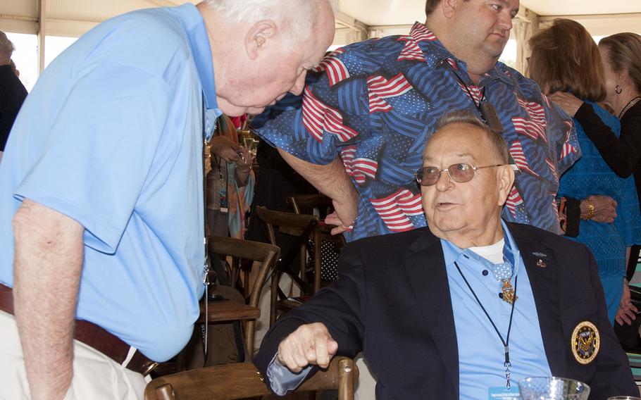 Two Medal of Honor recipients chat during lunch during the annual convention, held this year at the Eisenhower House in Gettysburg, Pa., near where the famous Civil War battle took place. 