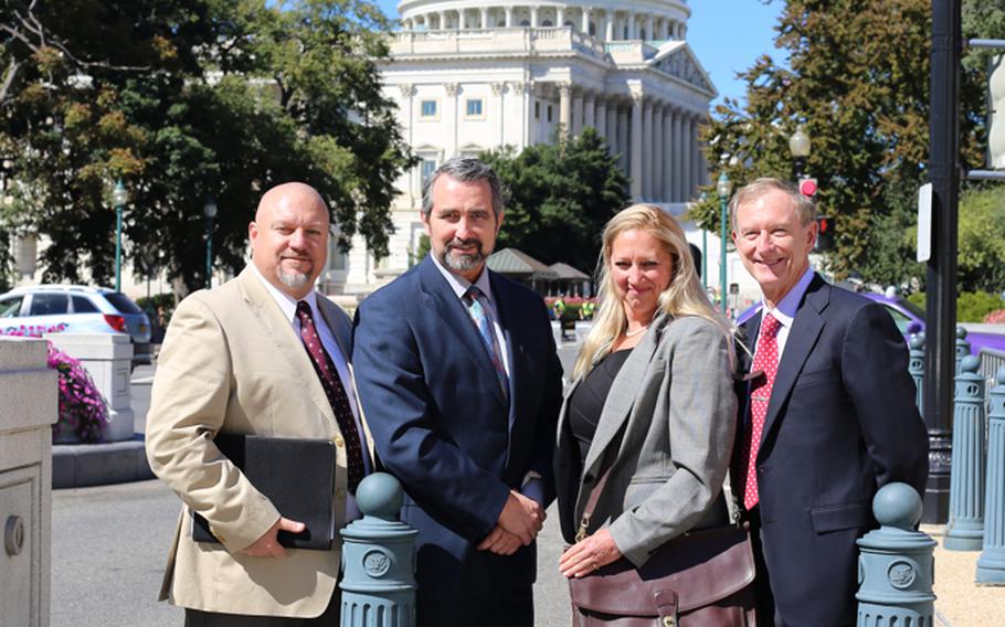 Defense Department overseas employees, from left, Cliff Elrod, Peter McCollaum, Joni Thomas and Steve Ewell, were on Capitol Hill last week asking lawmakers to intervene in an ongoing dispute over housing allowance pay from the DOD to overseas employees.
