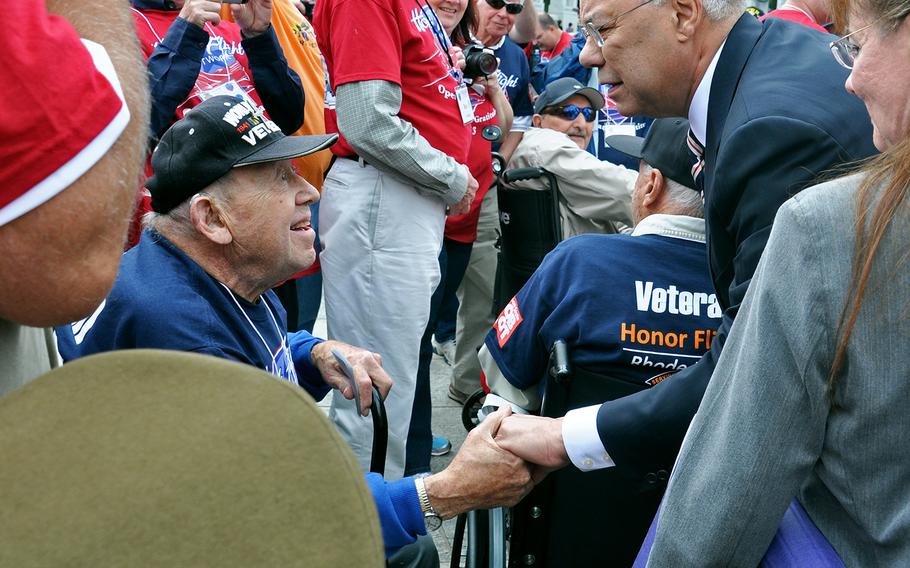 A World War II veteran shakes the hand of former Secretary of State Colin Powell on Sept. 28, 2013. The WWII veteran was part of the New England Honor Flight that flew to Washington, D.C. and Powell stopped by to greet the veterans. 