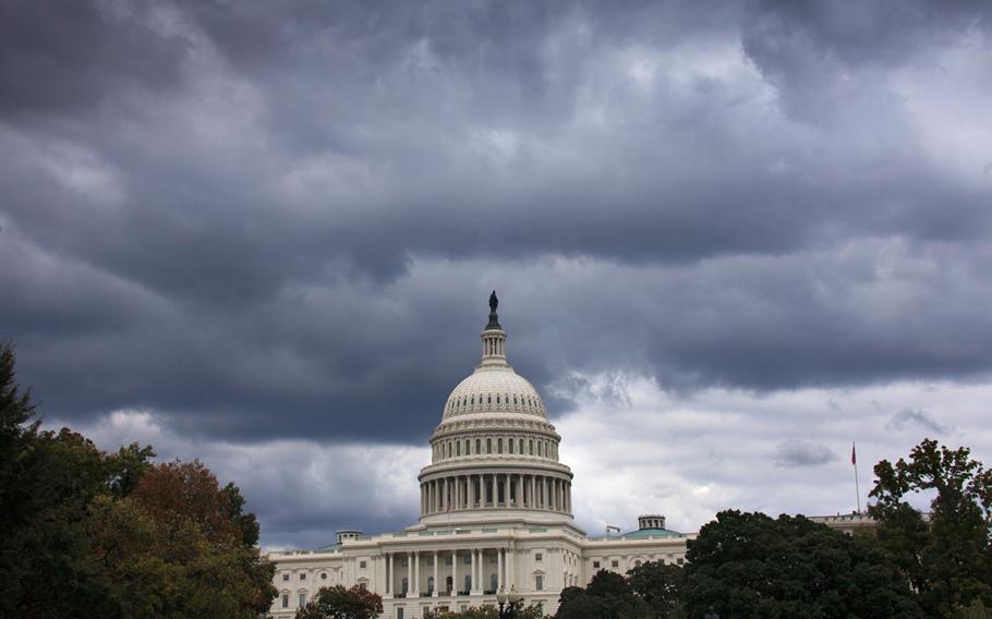 Dark clouds hang over the U.S. Capitol in Washington on Saturday, Sept. 28, 2013.